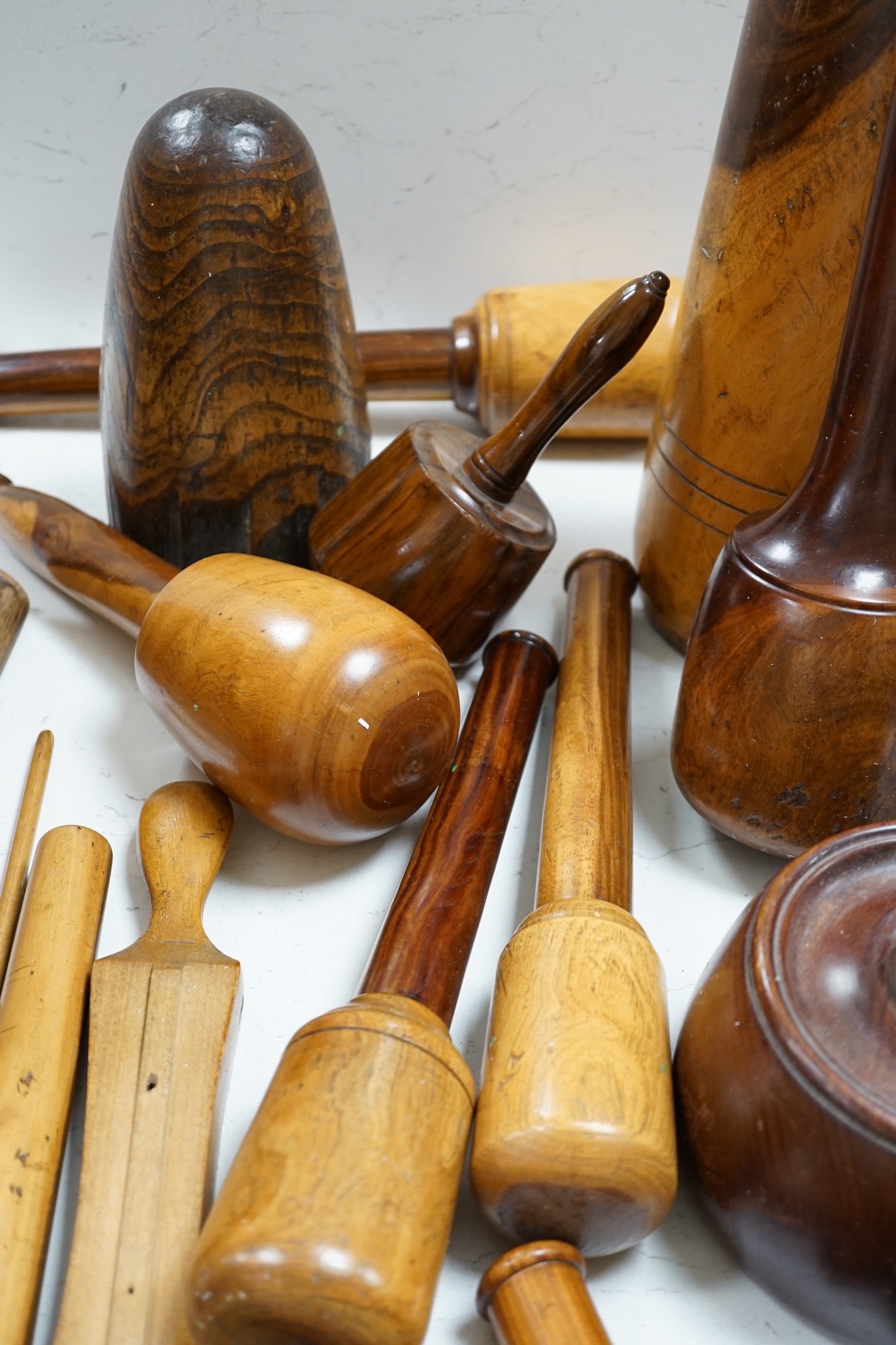 A mixed collection of treen leather and lead working tools etc. tallest 70cm